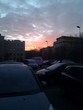 The sun setting over the car park at work